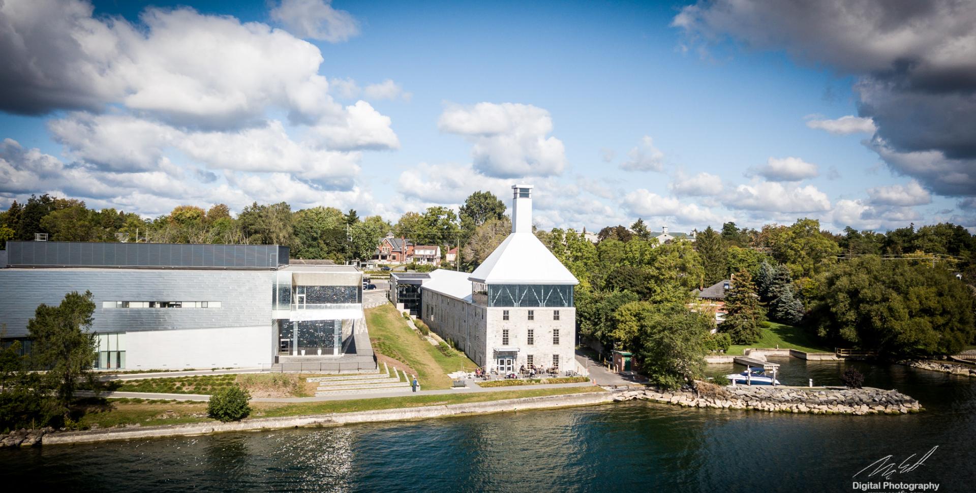 A white-roofed building located at the waterfront, providing ample space for various activities and services.