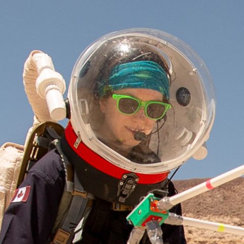 An image of Erin Kennedy in a spacesuit