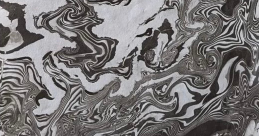 Black ink swirls on a white background